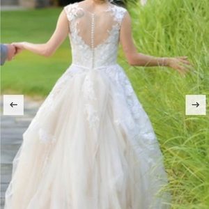 Cleaned and preserved wedding dress. Ivory and cream, tulle, embroidered bodice.